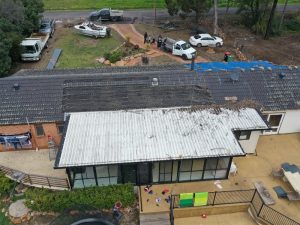 An old house with possible metal roof leaks needs inspection and repair.