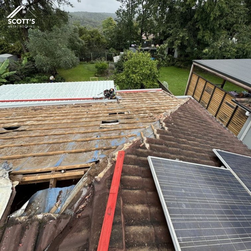 Metal Roof Repairs and Maintenance in progress—damaged roof being replaced with high-quality materials to restore durability and protection.