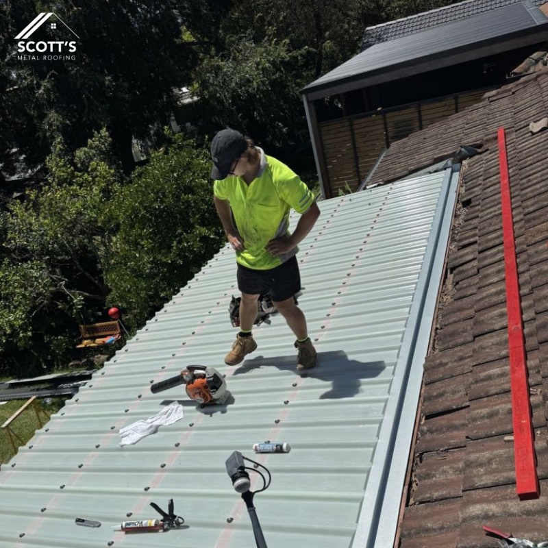 Expert performing Metal Roof Repairs and Maintenance, installing a new metal roof for long-lasting protection and structural integrity.