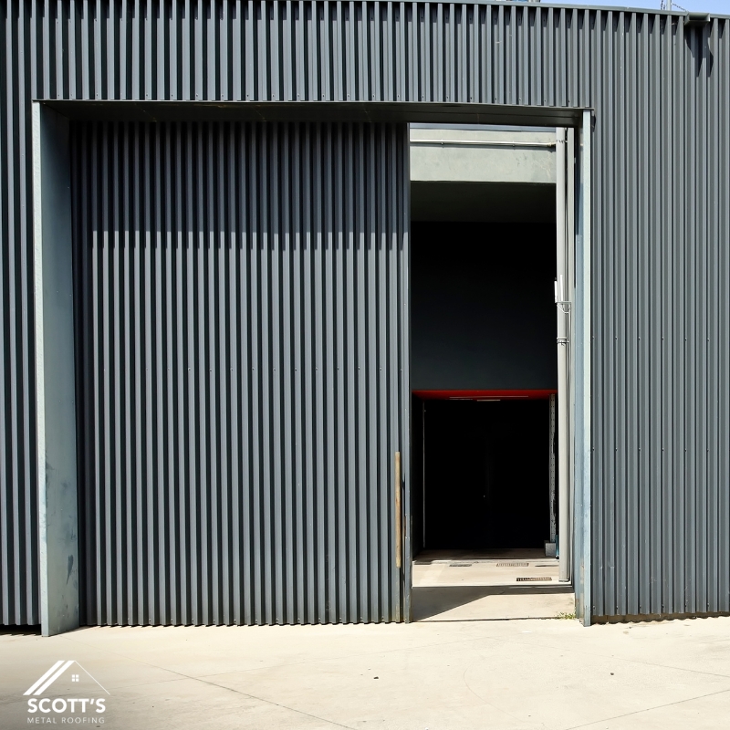 Industrial building exterior featuring vertical Aluminium Wall Cladding panels installed by Scott’s Metal Roofing in NSW.