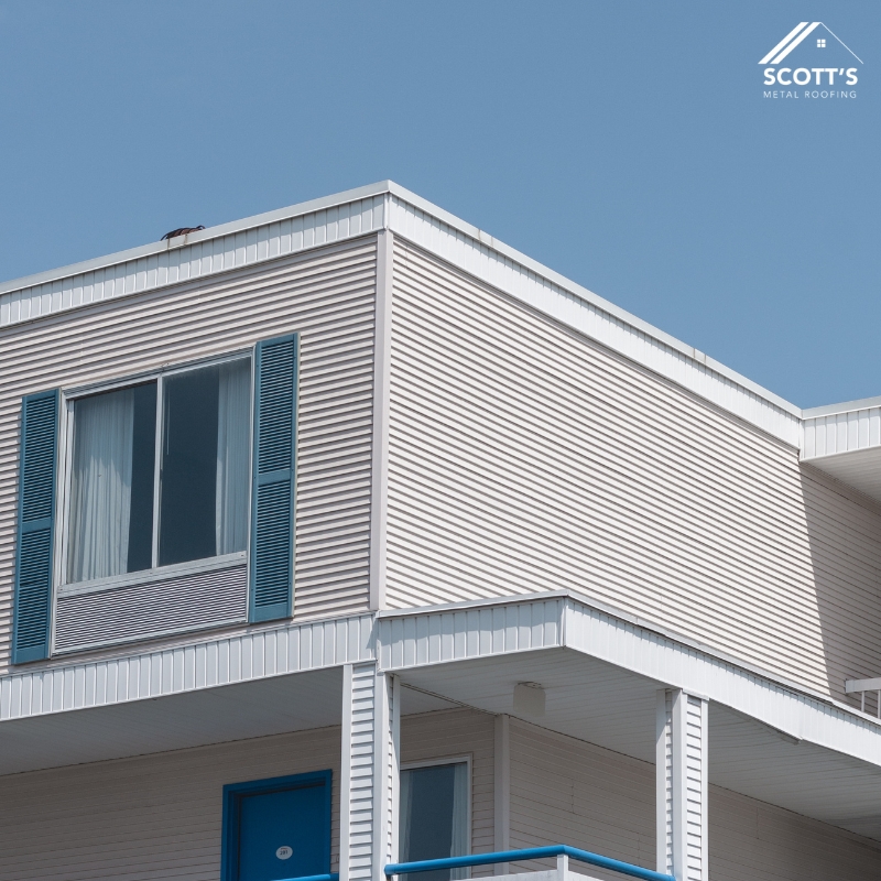 Modern home exterior featuring vertical steel wall cladding NSW with clean lines and blue window accents.