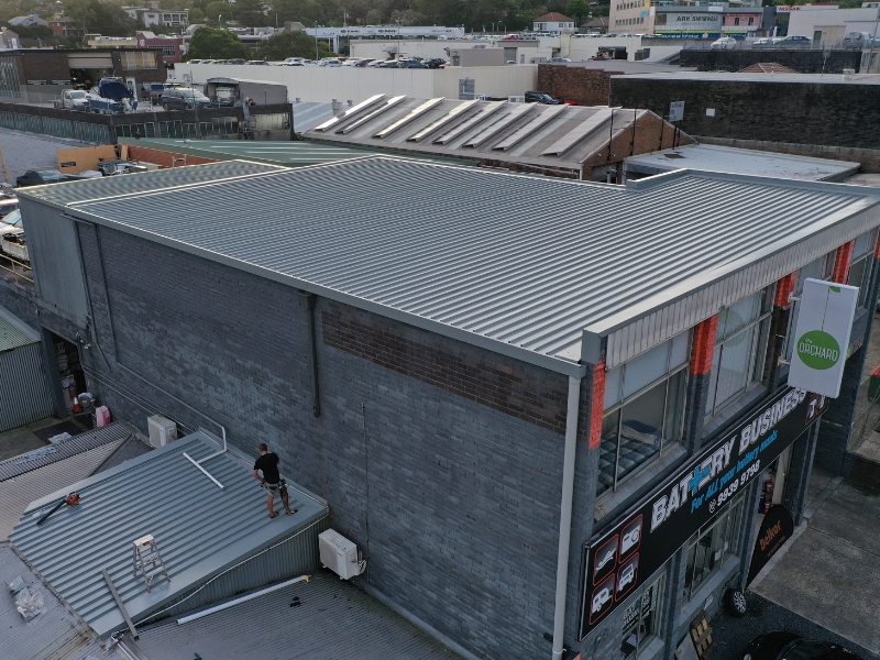 Maintaining a metal roof on a commercial building in an urban area