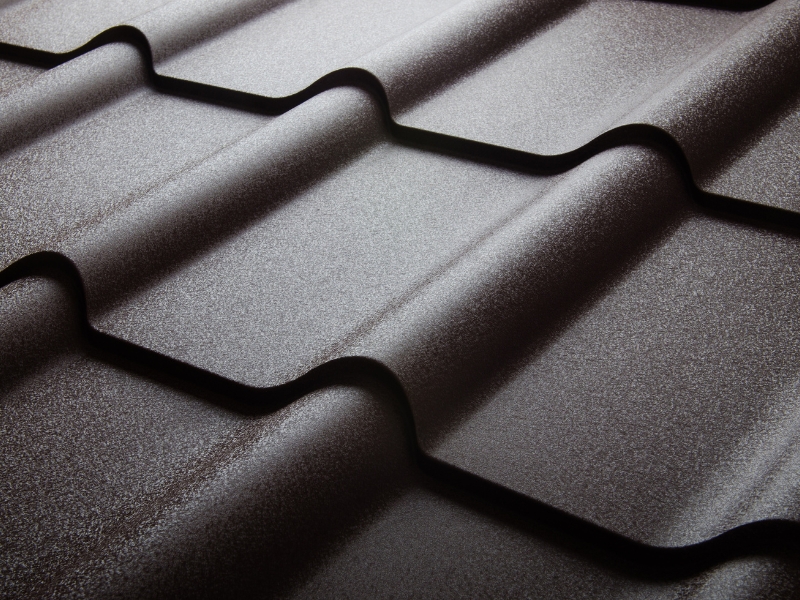 Metal tile panels prepared for installing sheet metal roofing on residential structures.